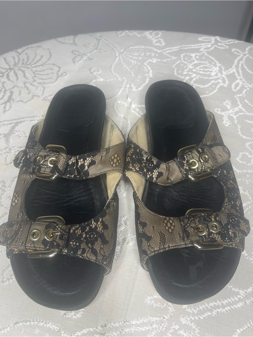 Stuart Weitzman Black and Gold Lace-Print Slide Sandals